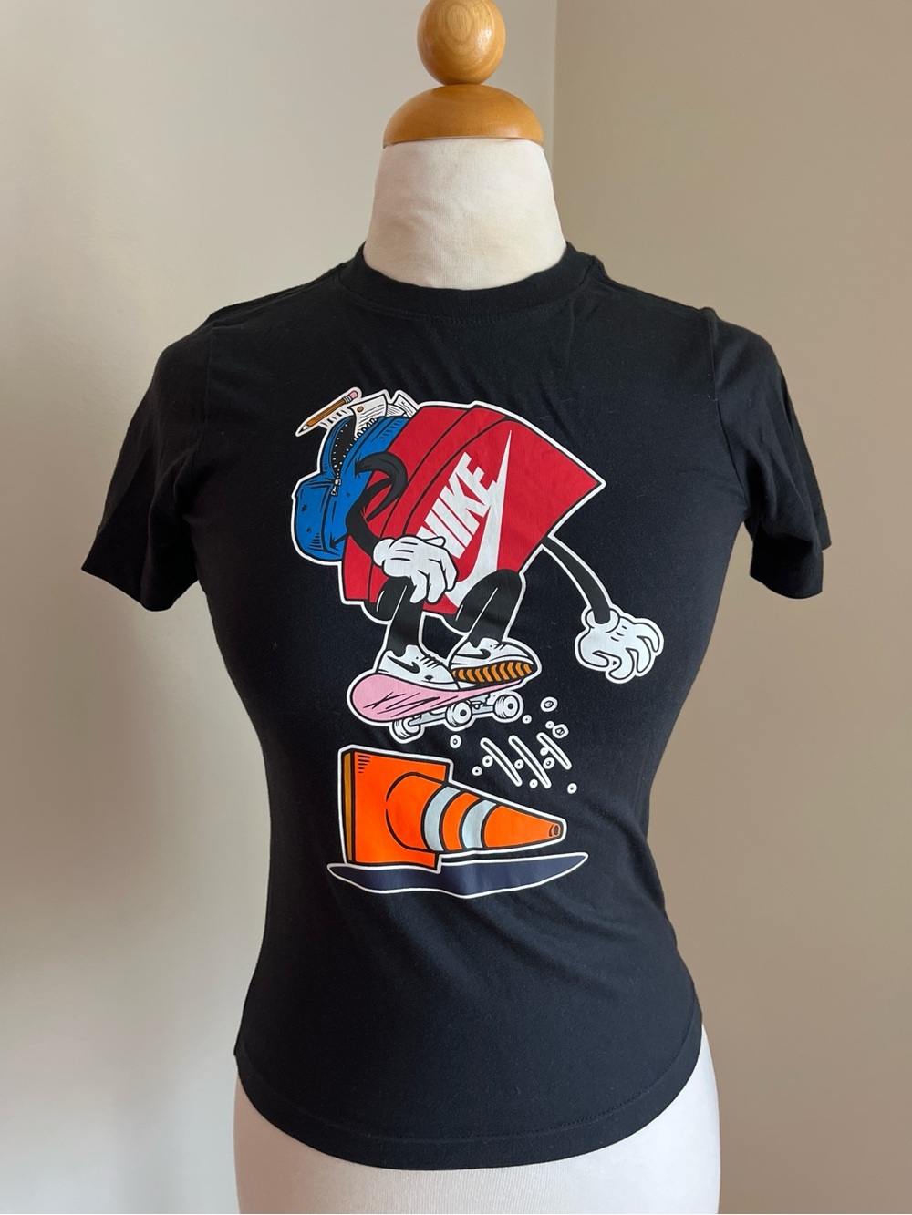 Nike black graphic tee with skater design